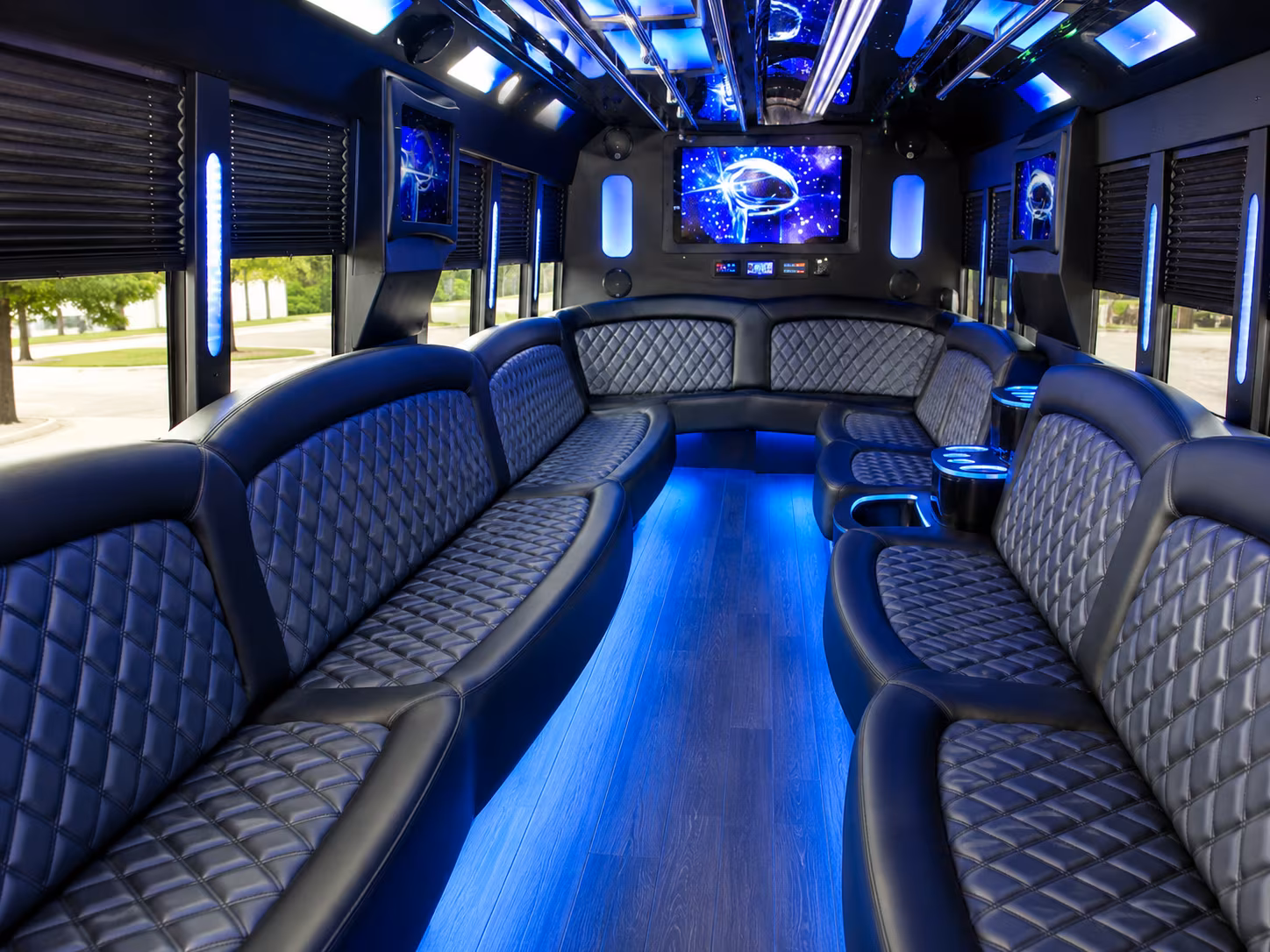 Friends laughing during a party bus celebration in Austin